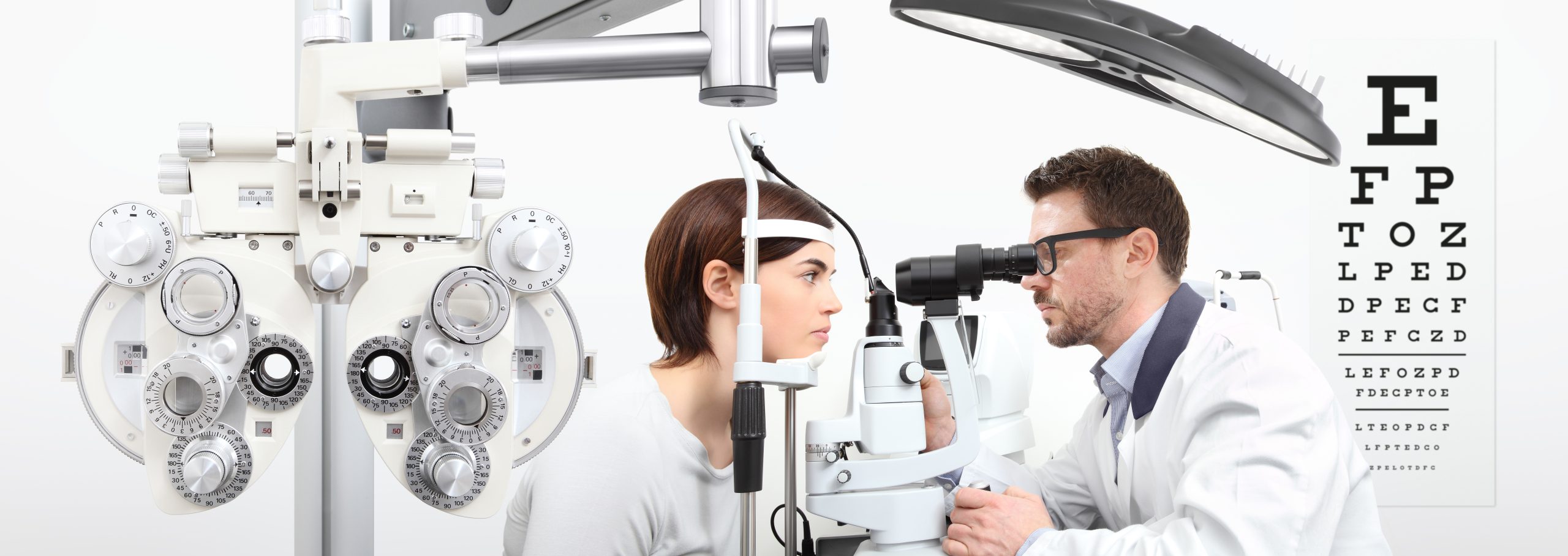 Patient undergoing a vision exam with a phoropter at Caldwell Vision Center